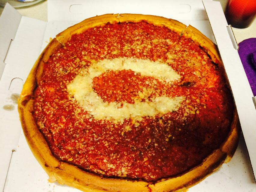 deep dish pizza with the Chicago Bears' logo